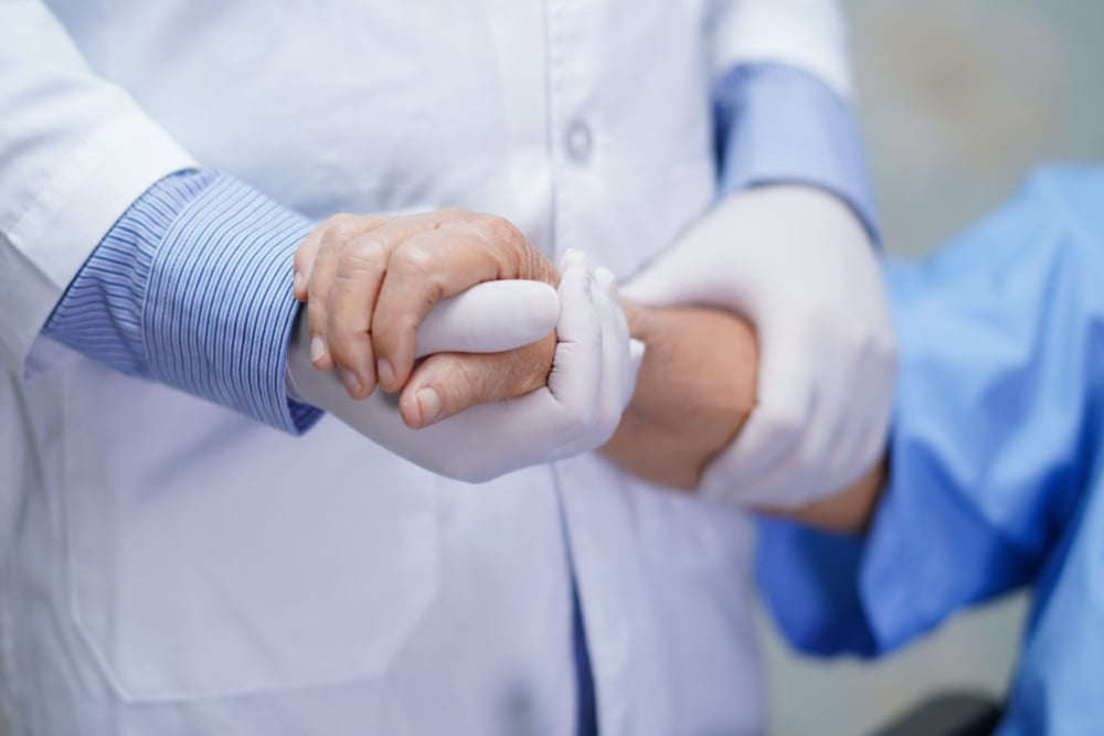 doctor examining a patient's arm