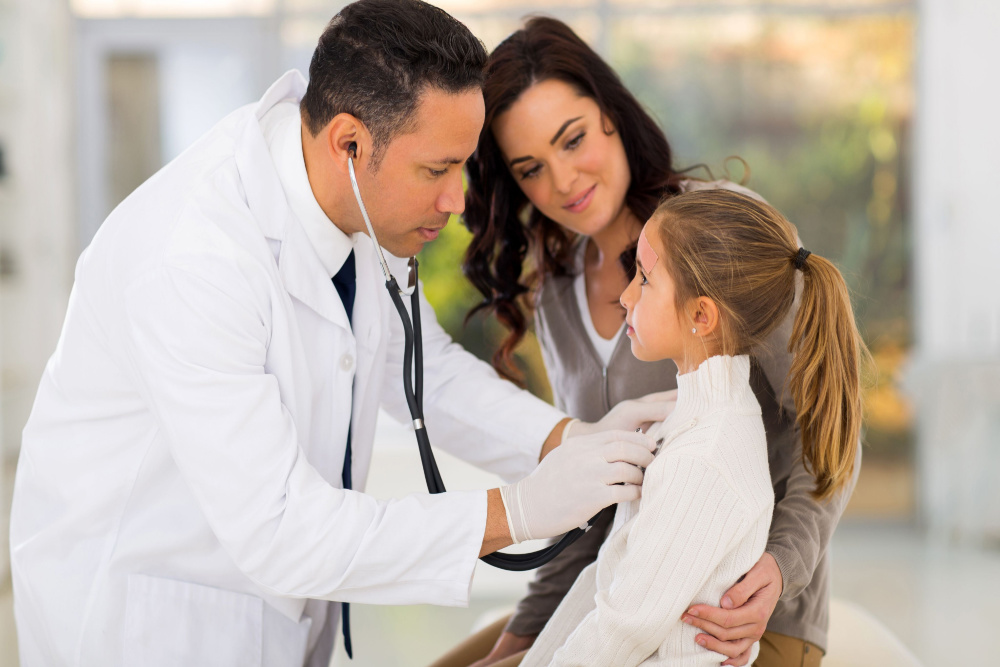 doctor checking on young girls health